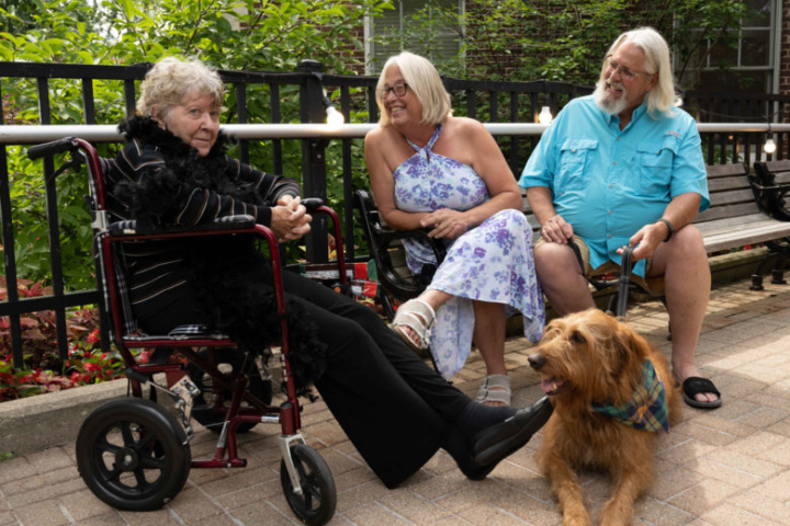 Assisted Living Resident with Family and Dog