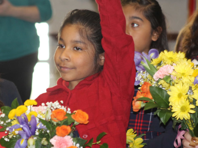 Child raising her hand