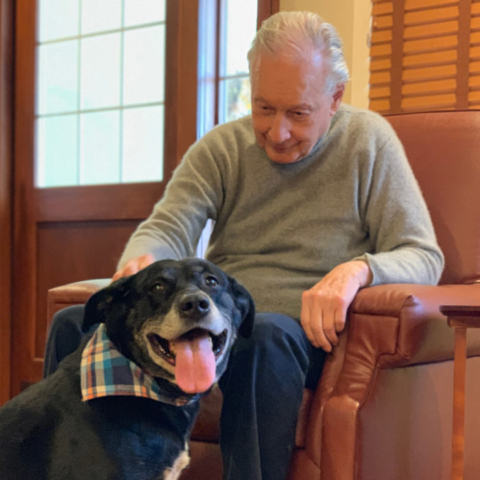 Resident Petting a Visiting Dog at The MacLean House