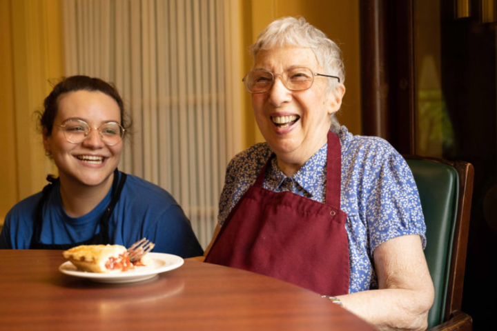 Assisted Living Resident Enjoying Dessert with Staff Member