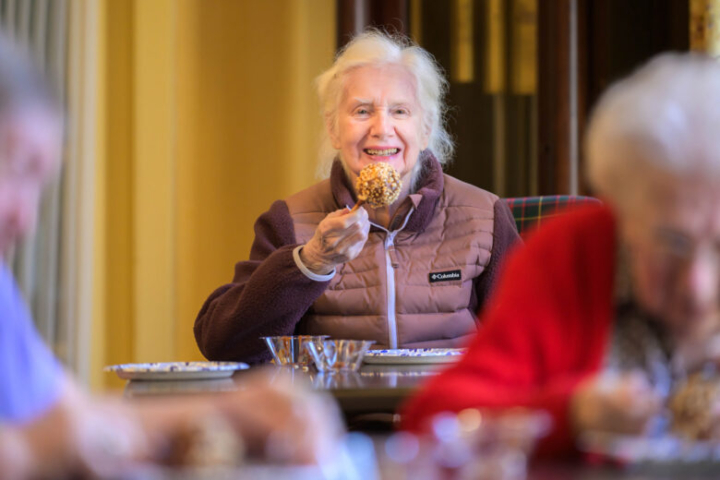 Resident Enjoying a Caramel Apple